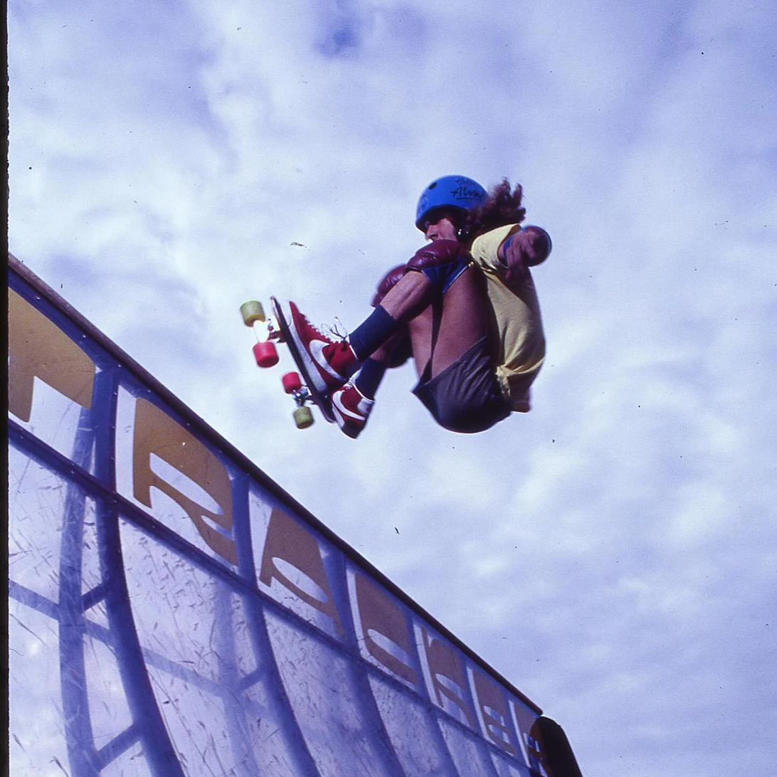 Tony Alva airborne above a skate ramp